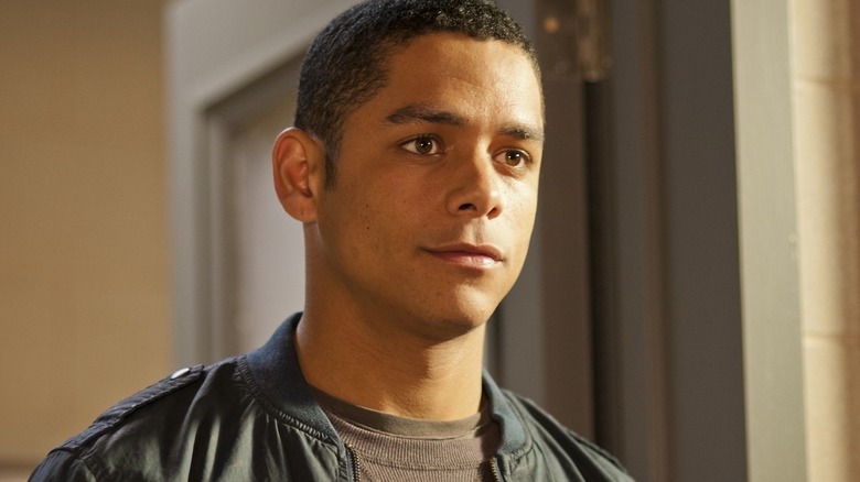 Charlie Barnett as Peter Mills smiling faintly on Chicago Fire