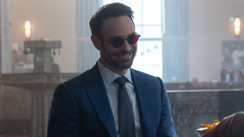 Charlie Cox as Matt Murdock smiling at the bank on Daredevil: Born Again