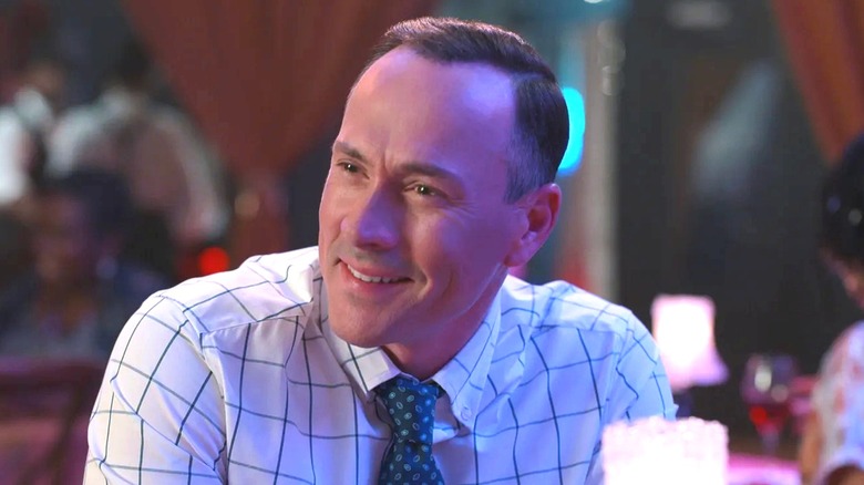 Chris Klein's Bill Townsend wearing a tie and smiling on Sweet Magnolias