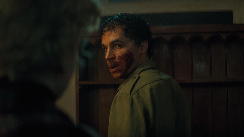 Christopher Abbott's Blake with blood all over his face in The Wolf Man.