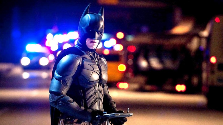 Batman surrounded by police cars in The Dark Knight Rises