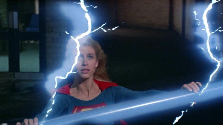 Supergirl holding an electric lamp post in Supergirl