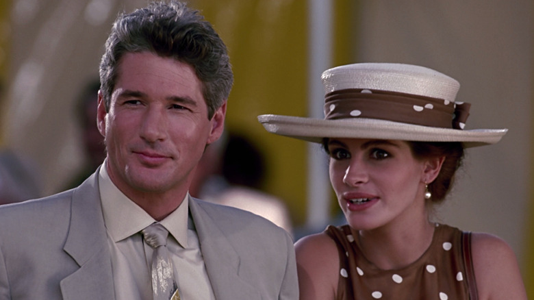 Edward and Vivian smiling at something in Pretty Woman