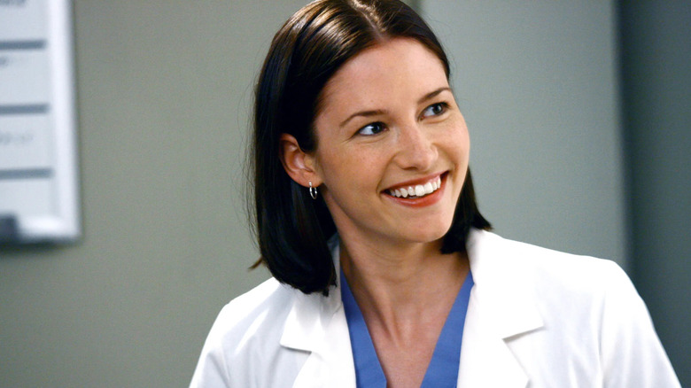 Lexie with short hair smiling on Grey's Anatomy