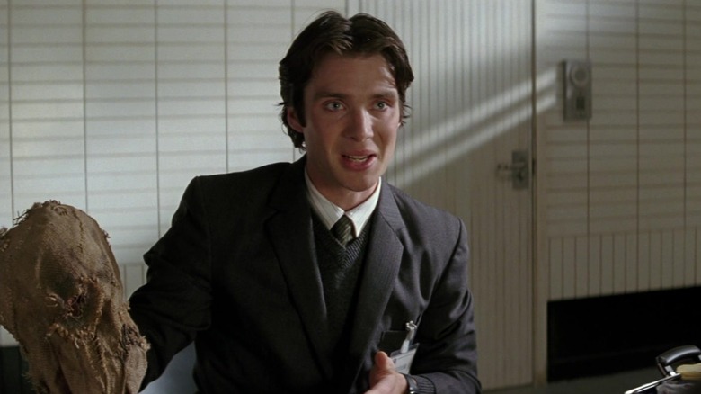 Jonathan Crane holding his Scarecrow mask in Batman Begins