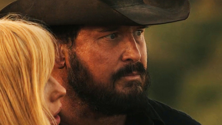 Cole Hauser's Rip Wheeler looks off into the distance next to Kelly Reilly's Beth Dutton in Dutton Ranch