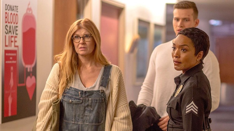 Abby Clark (Connie Britton) stands next to Athena Grant (Angela Bassett), with Evan Buckley (Oliver Stark) behind them.