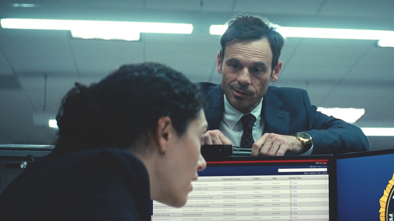 Danny looking over a cubicle wall in Furious