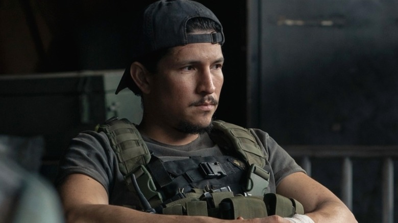 Manny sulks in a corner while working for the WLF in The Last of Us