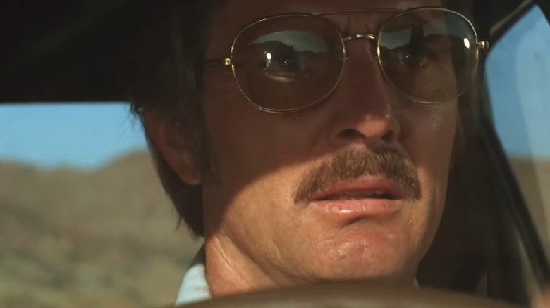 David looking stressed in his car in Duel