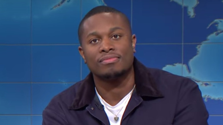 Devon Walker wearing a dark blue jacket on Saturday Night Live