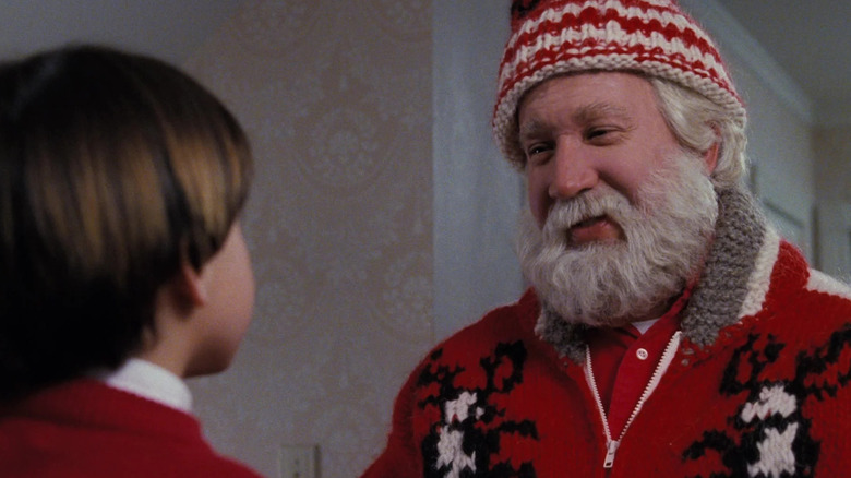Scott Calvin, turning into Santa Claus, smiling with his son Charlie in Santa Claus