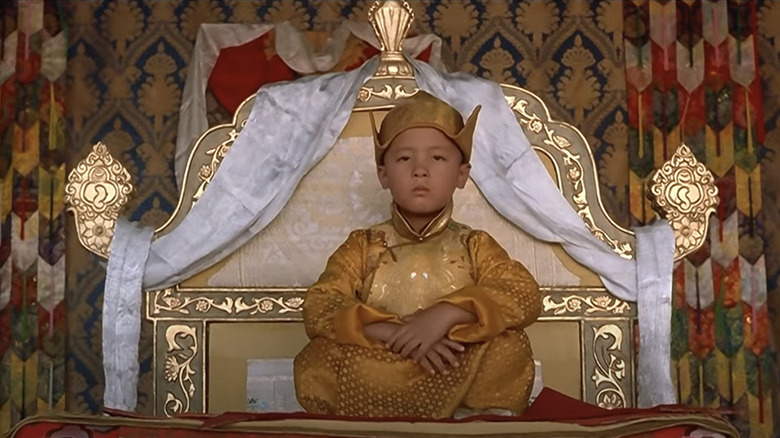 Tulku Jamyang Kunga Tenzin as the Dalai Lama sits on his throne in Kundun