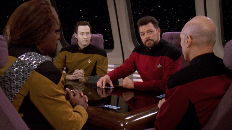 Worf, Data, Riker, and Picard around a conference table on Star Trek: The Next Generation