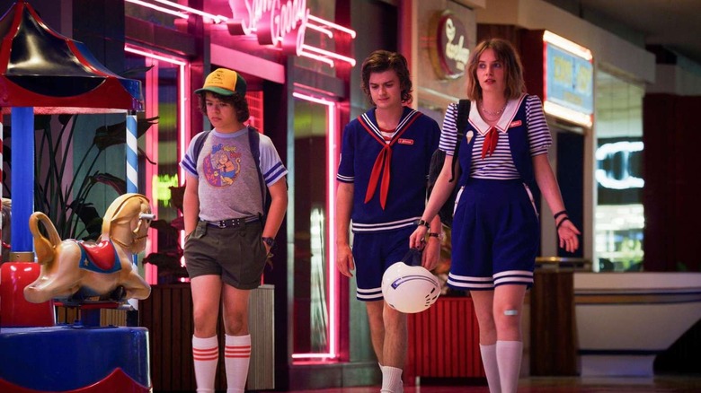 Dustin, Steve, and Robin outside a Sam Goody in Stranger Things