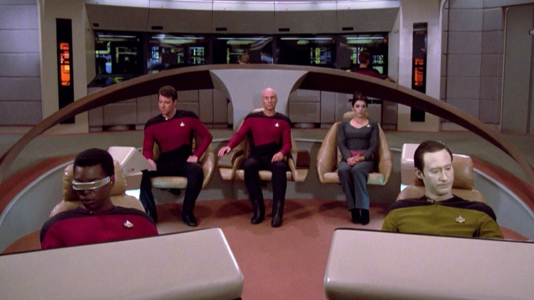 The bridge of the Enterprise-D, everyone at their stations, on Star Trek: The Next Generation