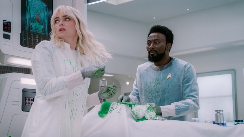 Nurse Chapel and Dr. M'Benga over a surgical table on Star Trek: Strange New Worlds
