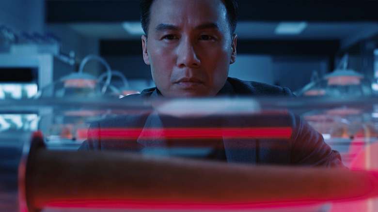 BD Wong as Dr. Henry Wu looking at the Indominous Rex bone in Jurassic World: Fallen Kingdom