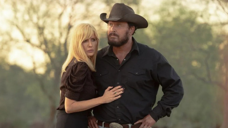 Beth (Kelly Reilly) holding onto Rip (Cole Hauser) on "Dutton Ranch."