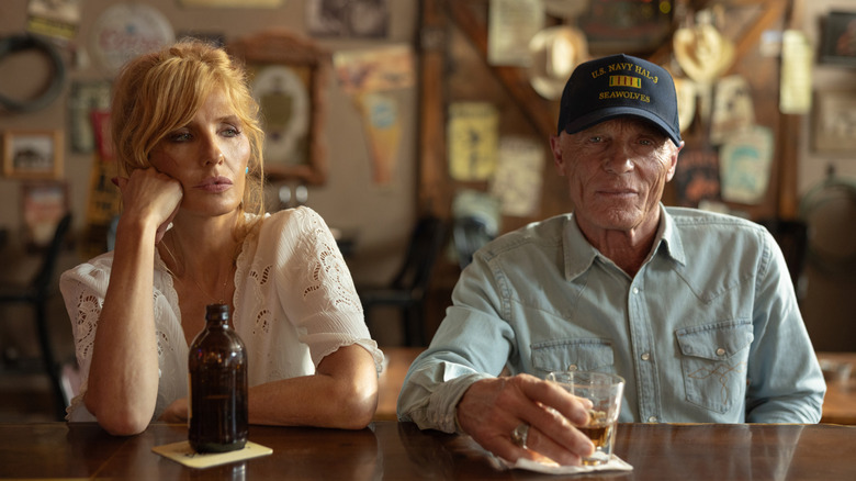 Kelly Reilly's Beth Dutton sits next to Ed Harris' Everett McKinney at a bar in Dutton Ranch
