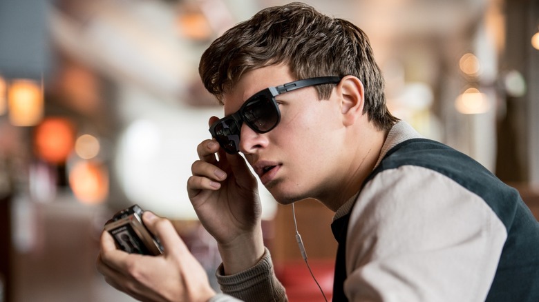 Ansel Elgort as Baby using his tape recorder at the diner in Baby Driver