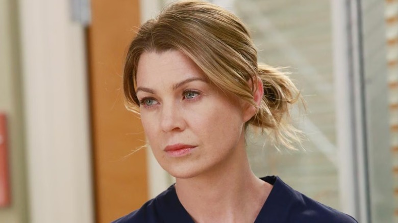 Meredith with her hair pulled back looking stern on Grey's Anatomy