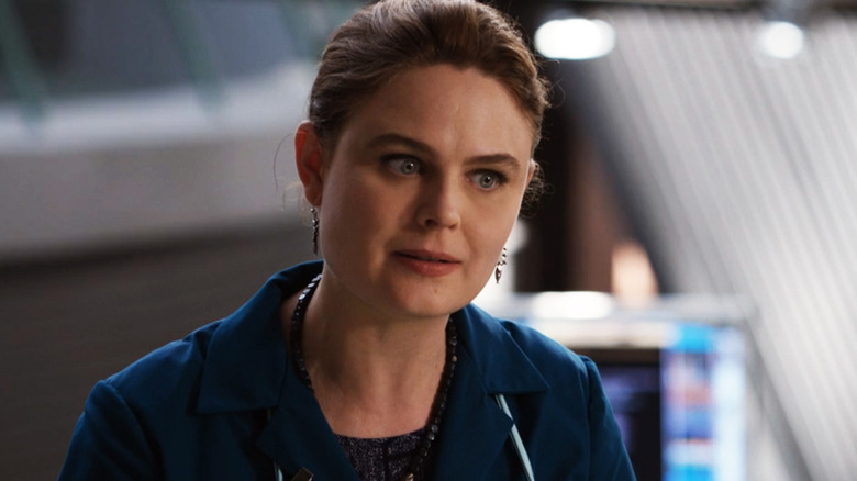 Emily Deschanel's Temperance Brennan looks annoyed as she stands in a lab in Bones