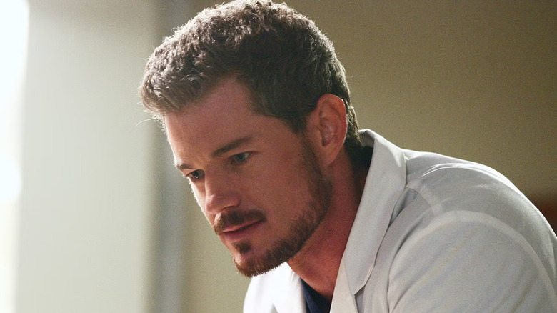 Mark Sloan leaning forward in a white coat on Grey's Anatomy