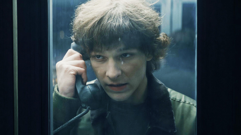 Mason Thames as Finney Blake talks on a payphone in Black Phone 2