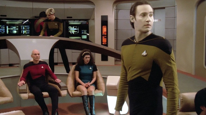 Data looking around at the viewscreen on the bridge of the U.S.S. Enterprise on Star Trek: The Next Generation