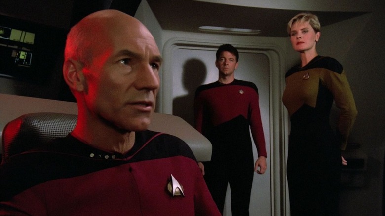 Picard in the captain's chair with Yar and Riker behind him on Star Trek: The Next Generation