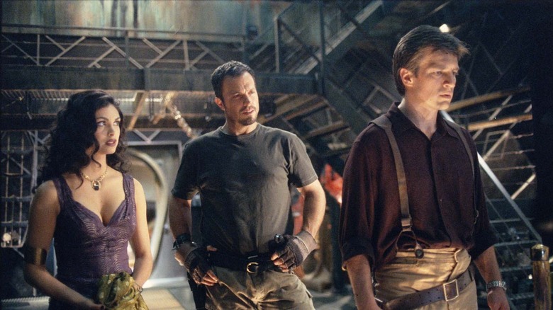 Nathan Fillion, Morena Baccarin, and Adam Baldwin in Firefly