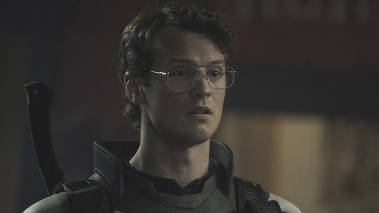 Freddie Stroma as Adrian/Vigilante on Peacemaker season 1 looking concerned
