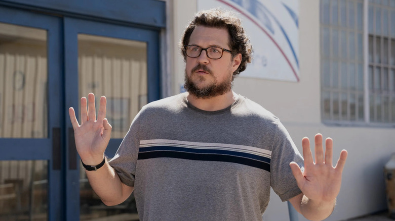 Gary (Cameron Britton) raising his hands on 