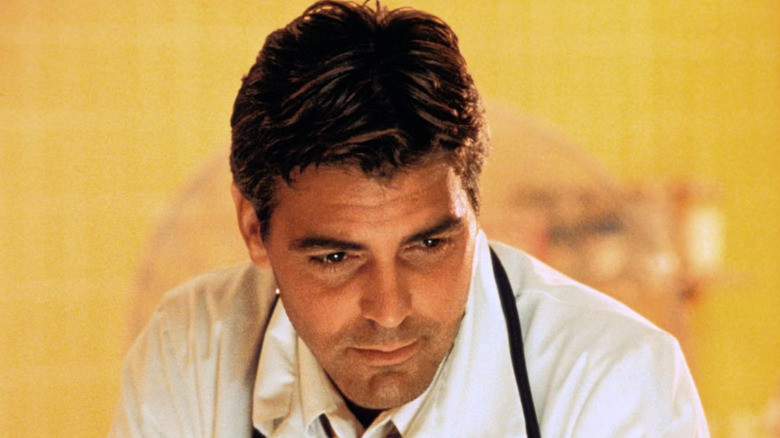Doug Ross in a warm light looking downwards