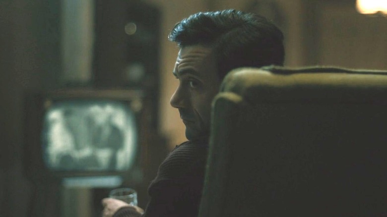 Morgan Spector as James turning around in his chair in Boston Strangler