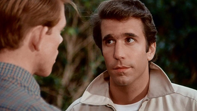 Henry Winkler as Arthur Fonzie Fonzarelli eying Ron Howard as Richie Cunningham in Happy Days