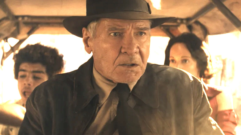Indiana Jones and the Dial of Destiny, Indy driving a cart with Teddy and Helena behind him