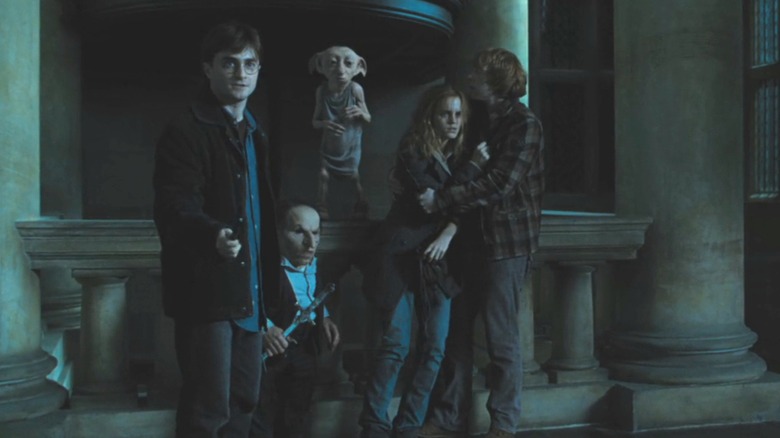 Harry, Griphook, Dobby, Hermione and Ron preparing to flee the Malfoy manor in Harry Potter and Deathly Hallows: Part 1