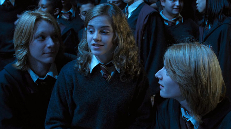 Fred and George circling Hermione in Harry Potter and the Goblet of Fire