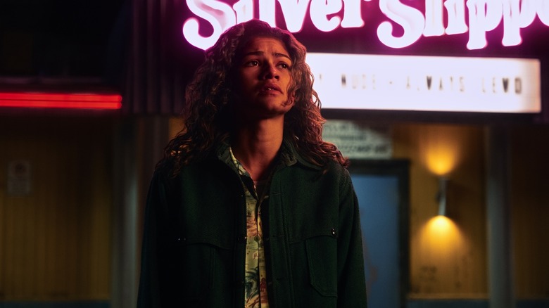 Rue looking worried in front of the Silver Slipper on Euphoria