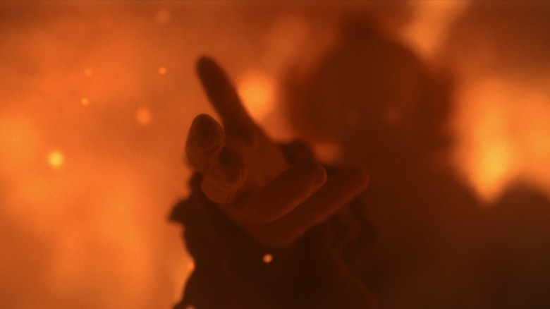 A still shot of Pennywise communicating in the trailer for It: Welcome to Derry