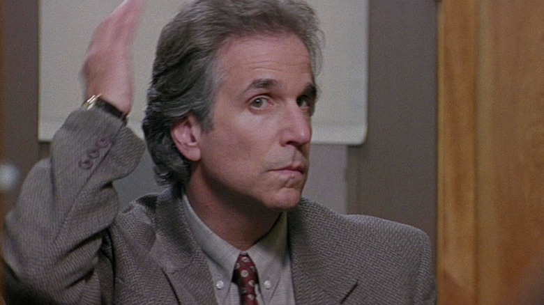 Henry Winkler as Principal Arthur Himbry checks out his hair in the mirror in Scream (1996)