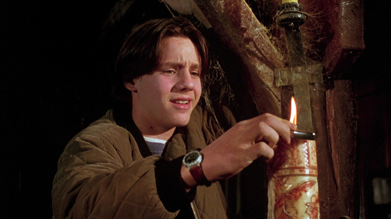 Omri Katz's Max lights a candle in the Sanderson Sister's cottage in Hocus Pocus