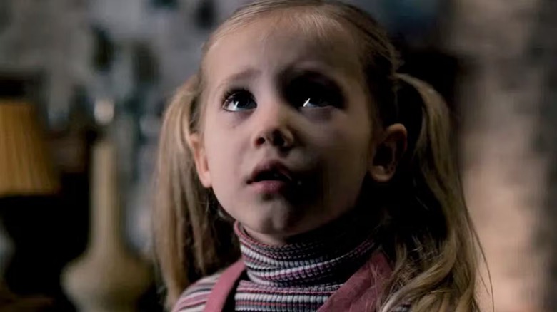 Young Holly Wheeler looking up at something in "Stranger Things"