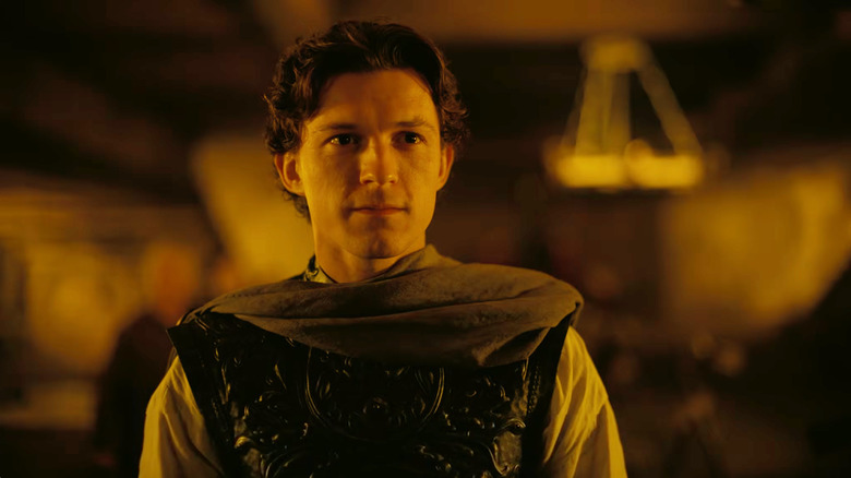 Tom Holland as Telemachus staring across the court of Ithaca in The Odyssey (2026)