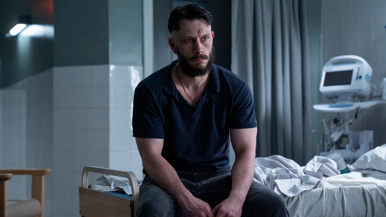 Ruben staring at Niall in the hospital