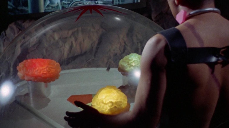 Three glowing brains in a bubble talking to Captain Kirk on Star Trek