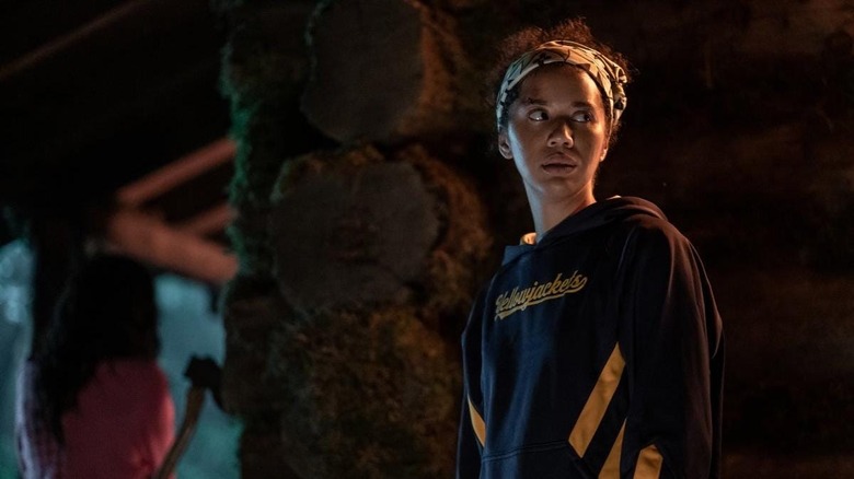 Taissa outside of the house found in the woods