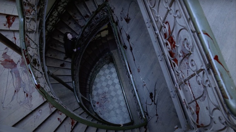 Anna (Adjani) looks up a blood-splattered spiral staircase in Possession